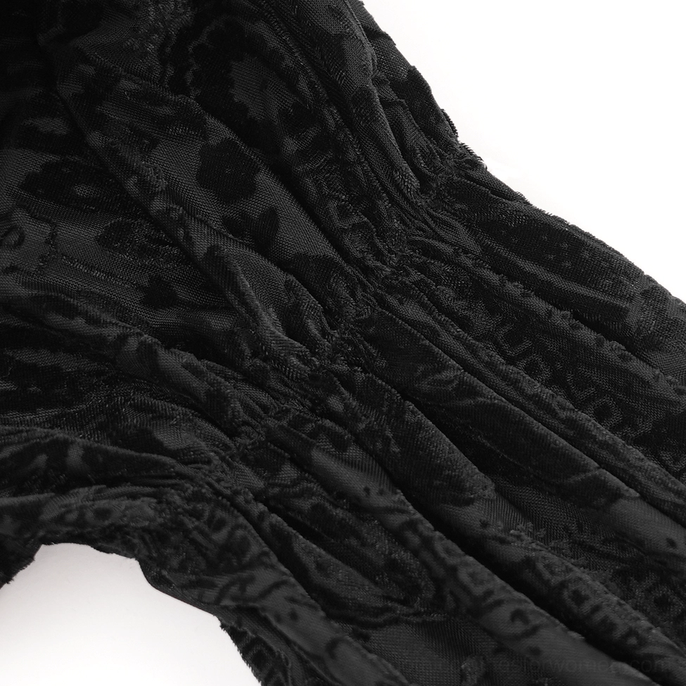 Flat lay view of gothic off-shoulder blouse displaying ruffled cuff details and puffed sleeve construction