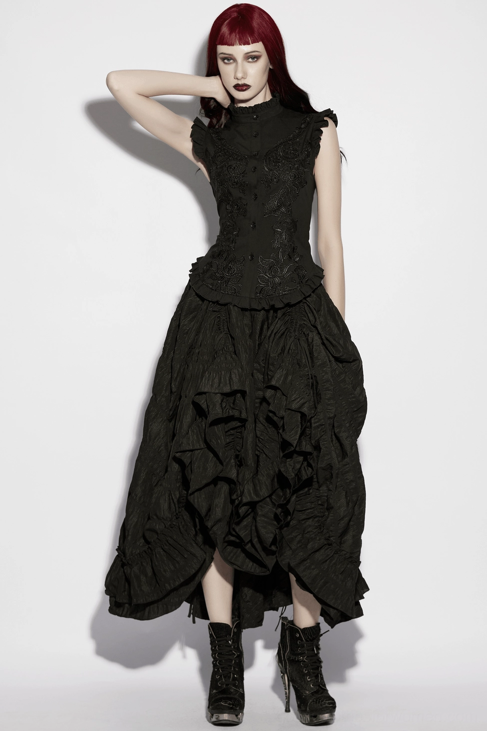 Gothic blouse hem and ruffle trim detail - close-up of intricate frilled edging on black fabric