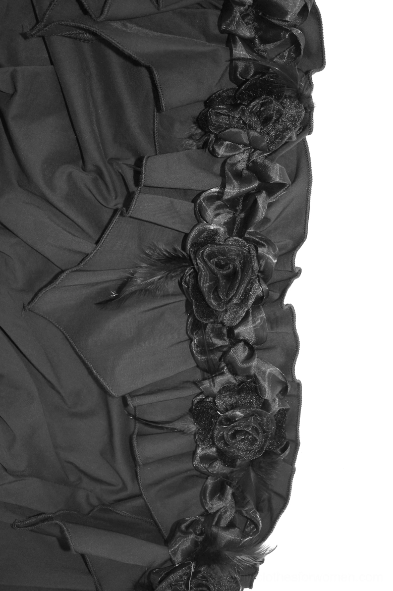 Close-up of gothic blouse shoulder appliqué featuring three-dimensional fabric rose with feather embellishments and ruffled edge trim