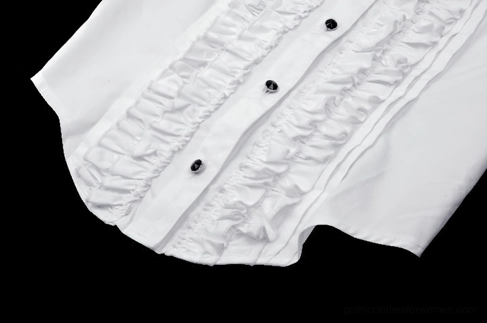 Angled close-up flat lay of white gothic blouse side placket showing ruffled front rows and tailored fabric edges
