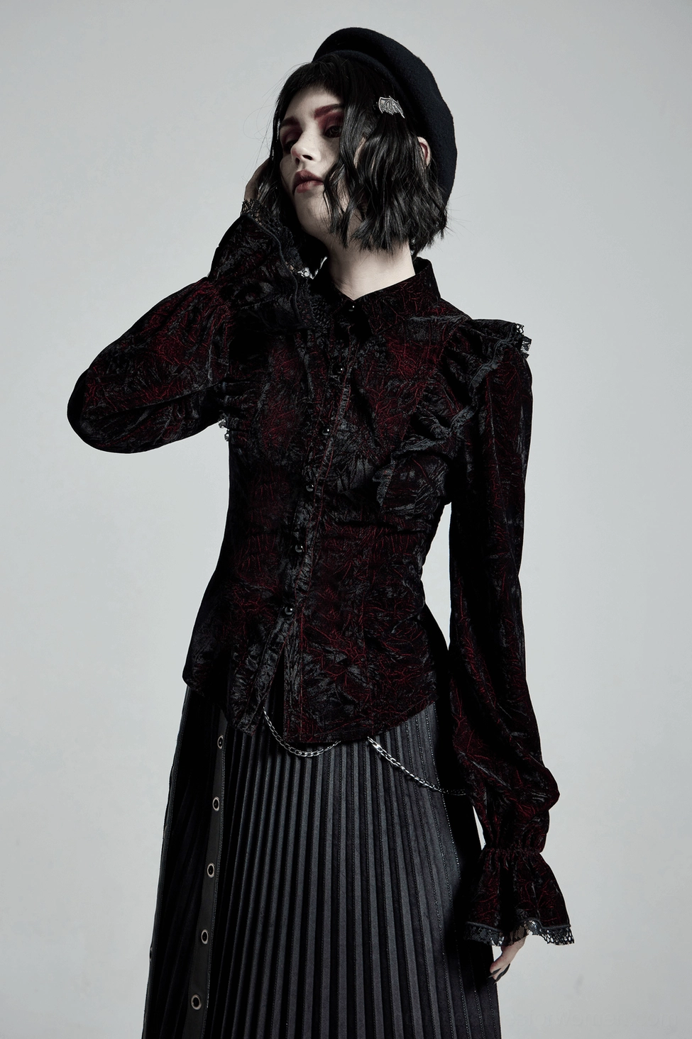 Gothic velvet blouse size and fit demonstration on model with measurement reference