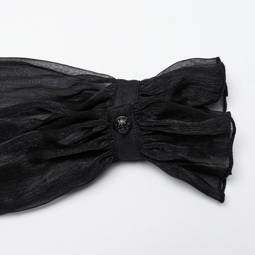 Black gothic blouse cuff detail close-up showing sheer organza fabric, decorative button, and ruffled trim