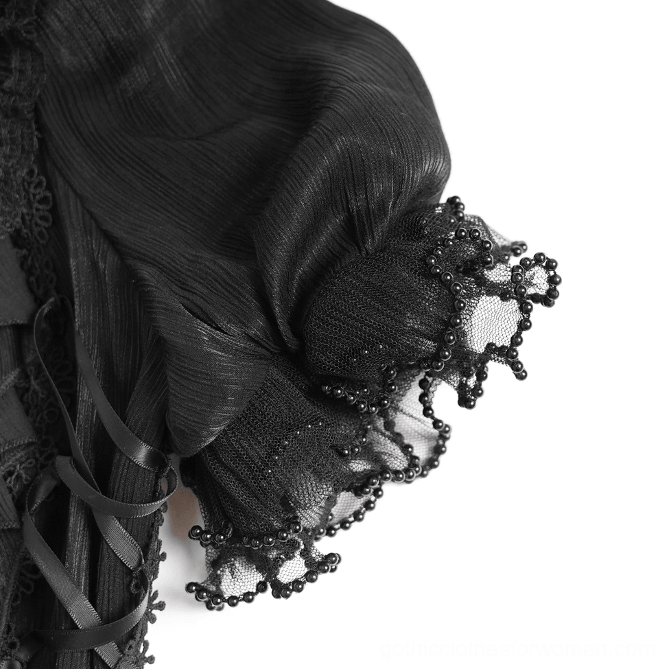 Close-up detail of gothic blouse puff sleeve showing beaded lace trim, crinkled sheer fabric, and side ribbon ties