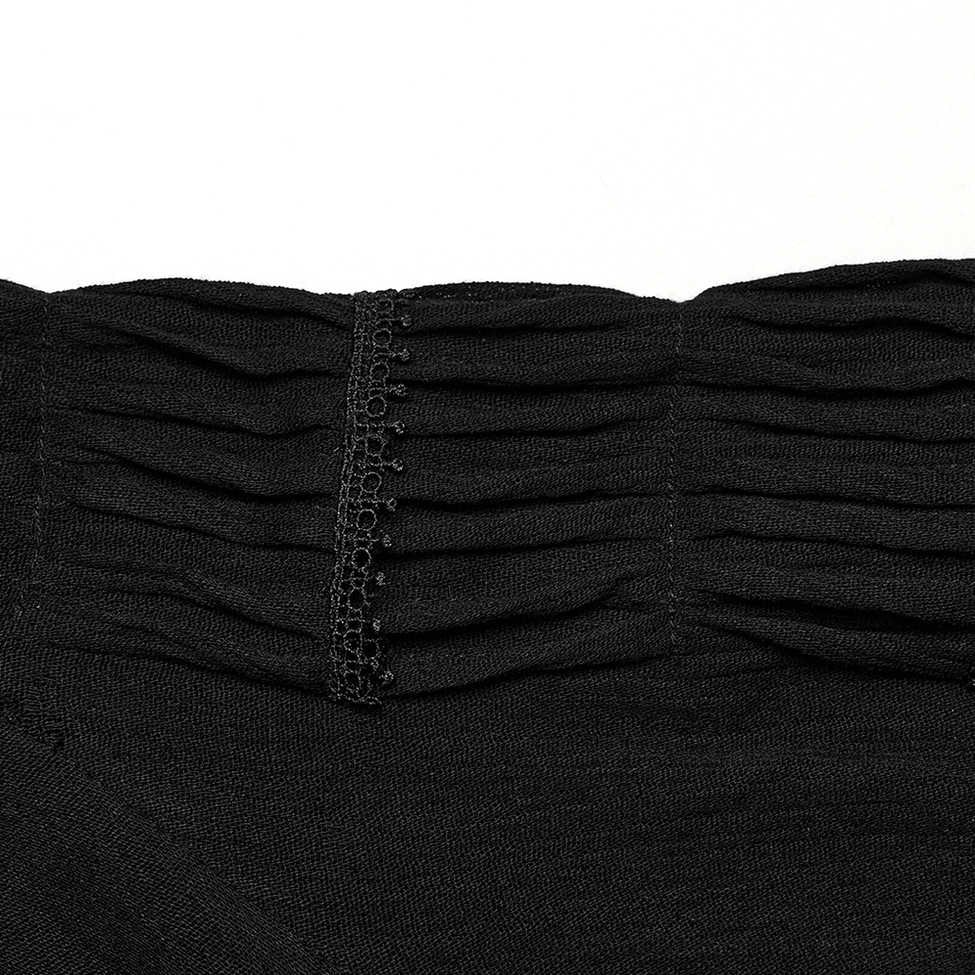 Detailed close-up of gothic blouse sleeve showing gathered pleated fabric and central embroidered trim