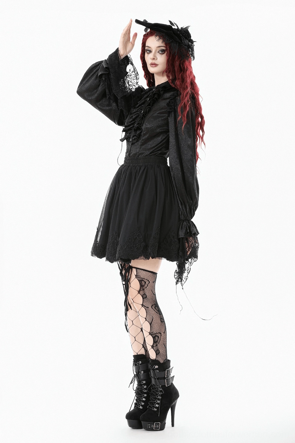 Styled photoshoot detail of gothic blouse showing theatrical lighting and dramatic fashion presentation