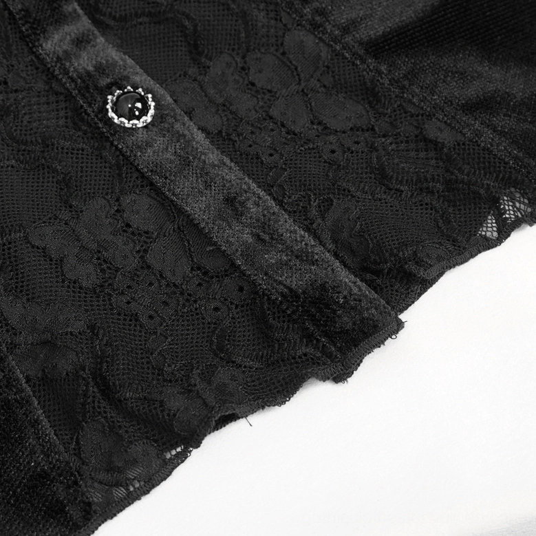 Close-up side view of black gothic blouse front trim showing decorative gemstone buttons, velvet edging, and gathered lace sleeves