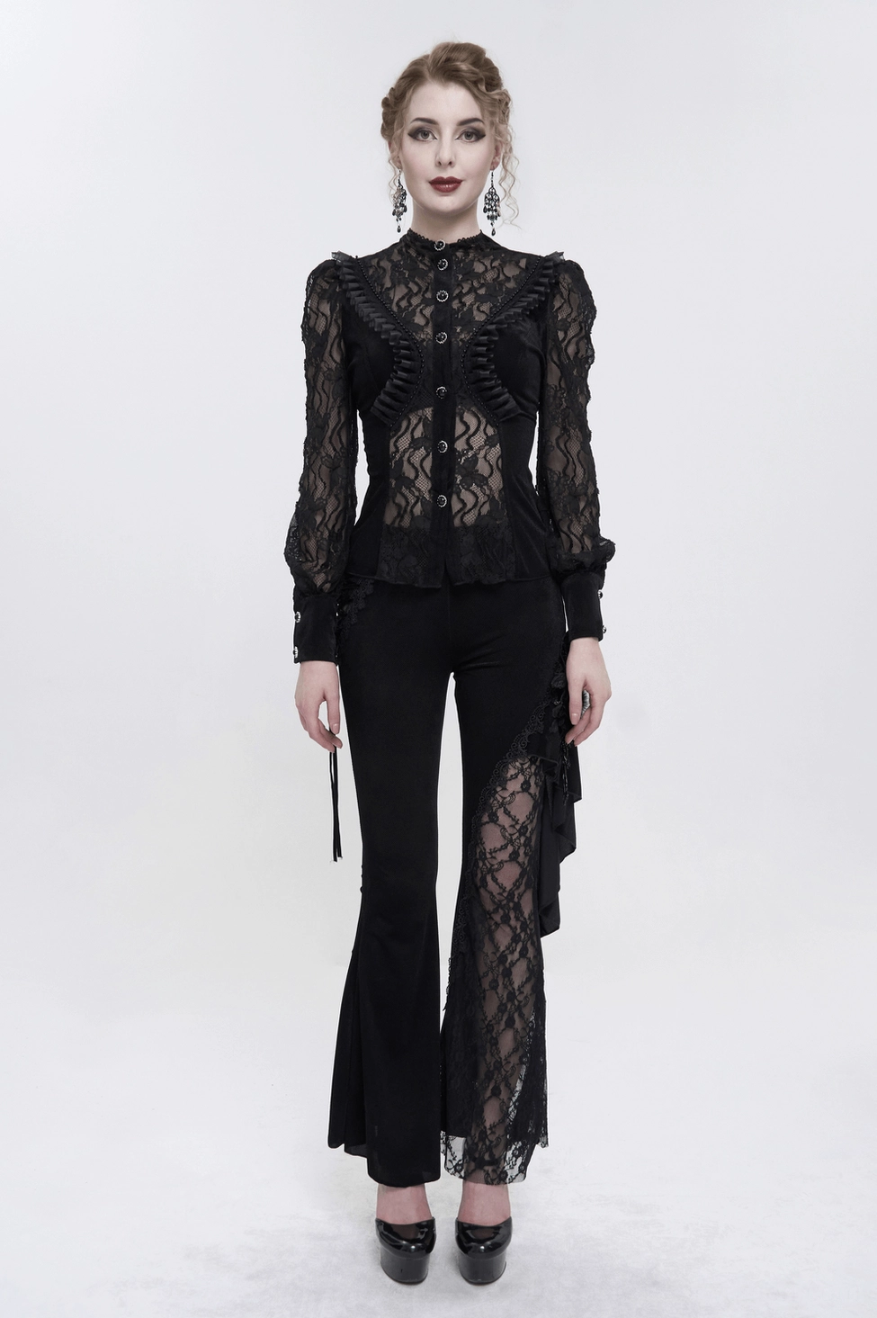 Texture close-up of black gothic blouse showing luxurious velvet fabric surface and intricate lace element placement