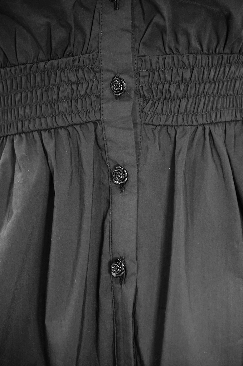 Front close-up detail of gothic blouse waist showing smocked elastic waistband, rose-shaped decorative buttons, and button placket construction