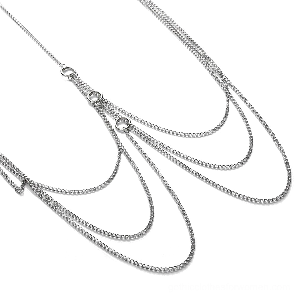 Close-up detail of silver aluminum curb chains and circular metal fasteners from gothic body chain harness