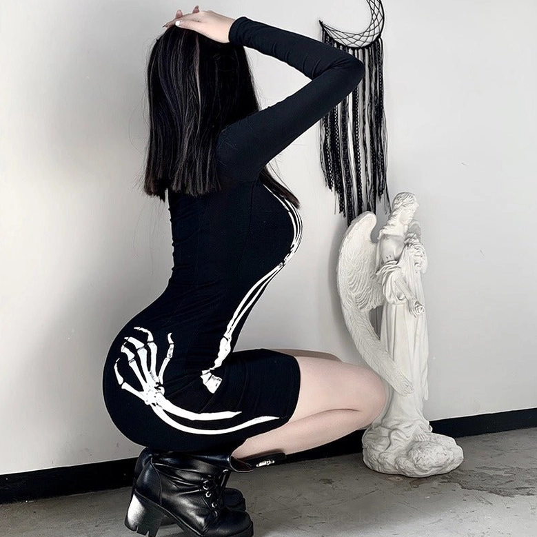 Black skeleton hand bodycon mini dress displaying overall silhouette and print placement on fitted form