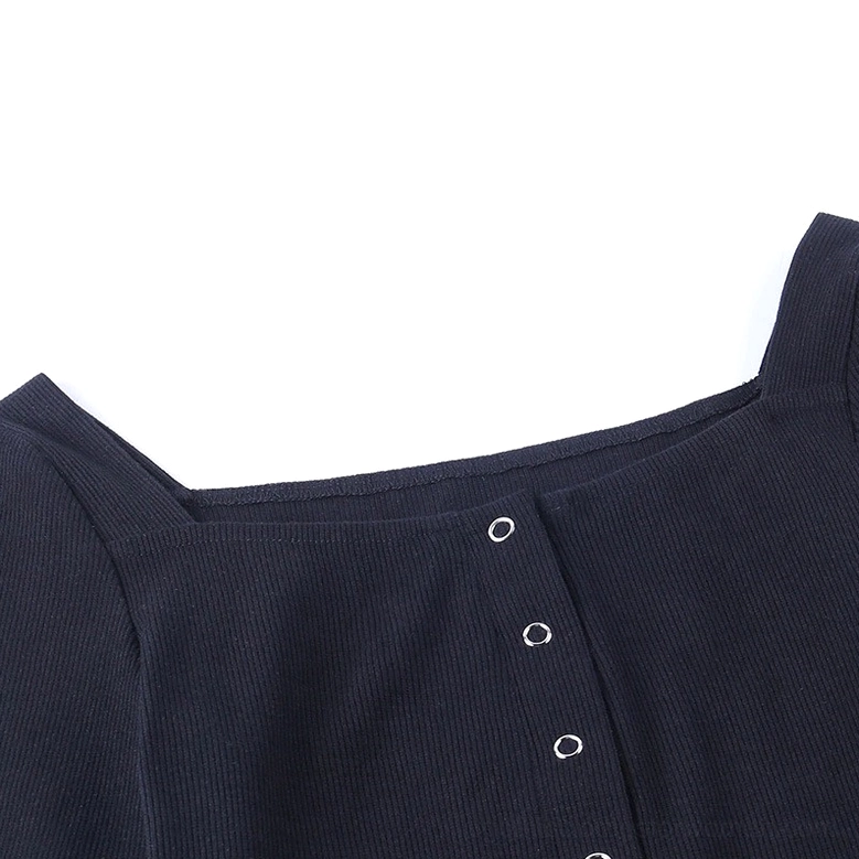 Close-up detail of gothic bodysuit neckline and metal snap buttons on ribbed knit fabric