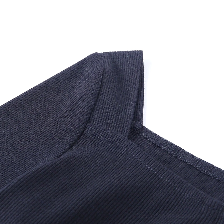Gothic bodysuit shoulder and sleeve construction, vertical ribbed texture with clean seam finish