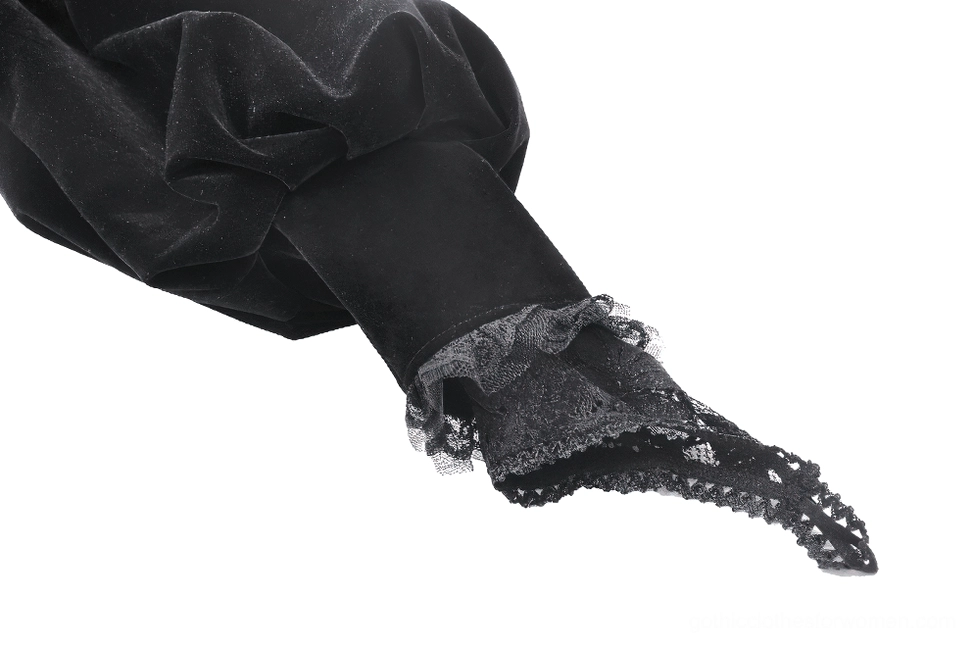 Close-up side view of black gothic bolero sleeve cuff featuring sheer lace trim and velvet puff sleeve construction