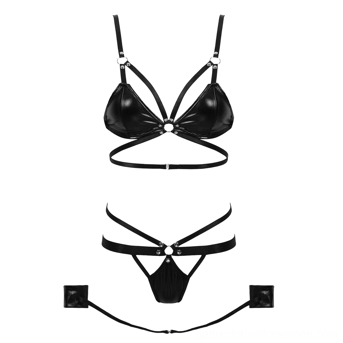 Complete black gothic bondage lingerie set flat lay, displaying crisscross strap bra, pull-through briefs, and metal hardware components