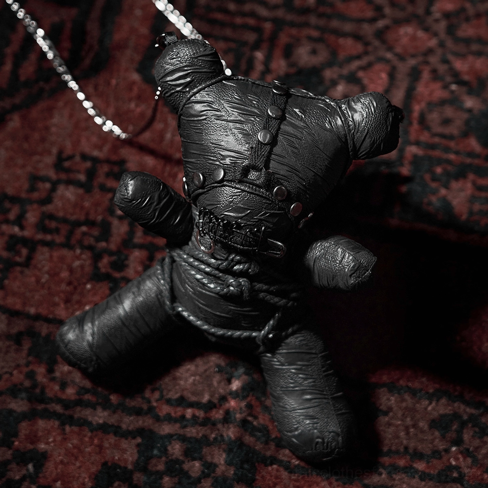 Black gothic bondage teddy bear pendant accessory with industrial aesthetic and metal embellishments