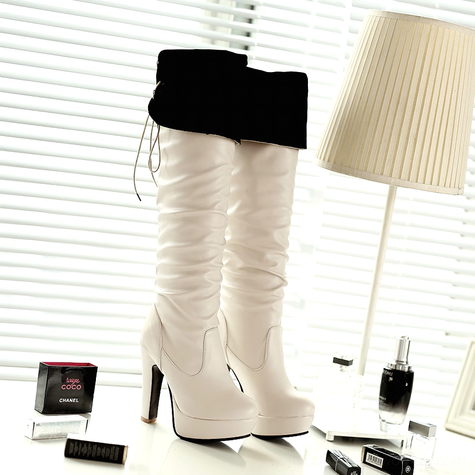 Gothic over-the-knee boot demonstrating adjustable back lace-up feature and ruched shaft design