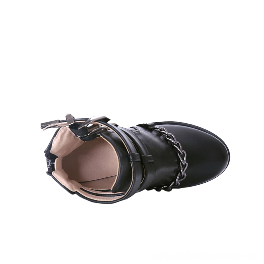 Inside-out black gothic platform boot flat lay showing inner lining, buckle straps and chain construction