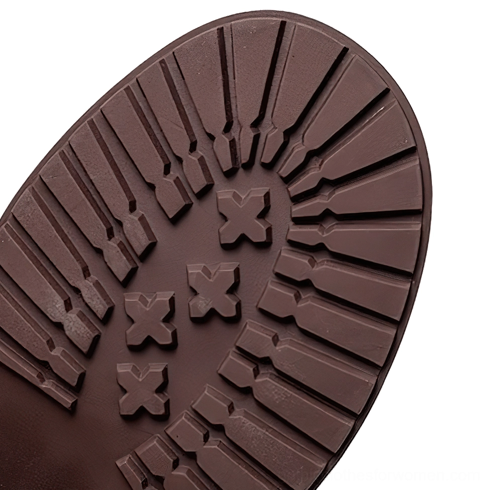 Gothic boot rubber outsole with anti-slip tread pattern and X-shaped embossments, top-down view