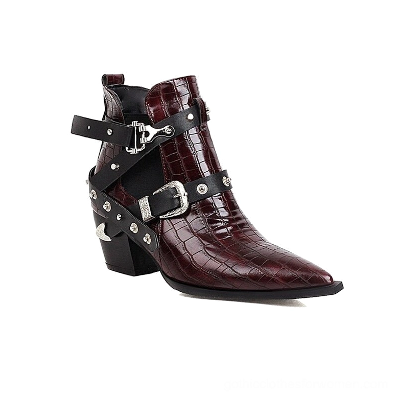 Women's gothic pointed toe boots demonstrating ankle height and buckle strap design from side angle