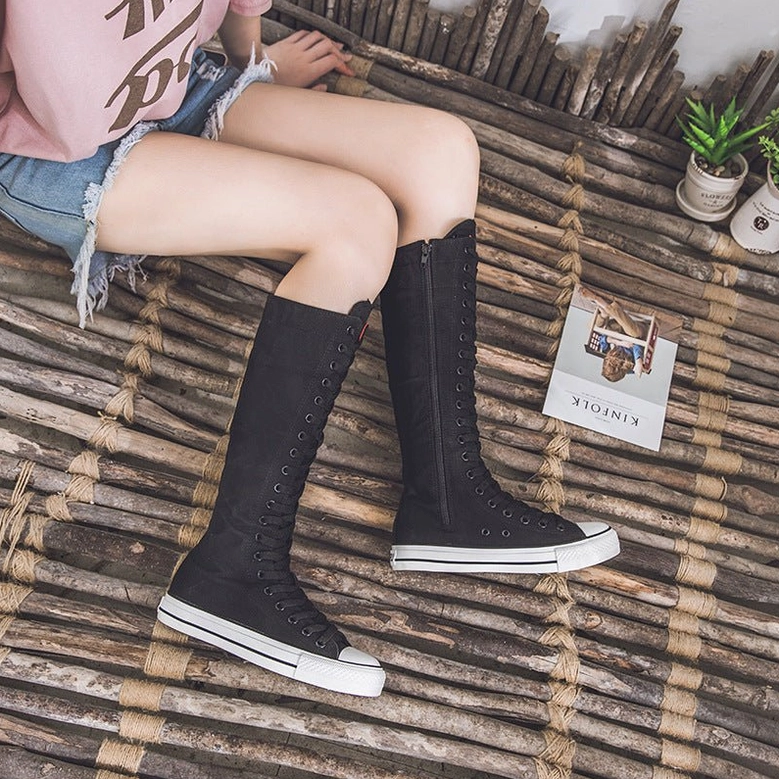 Canvas high-top gothic boots flat lay photography showing both color options