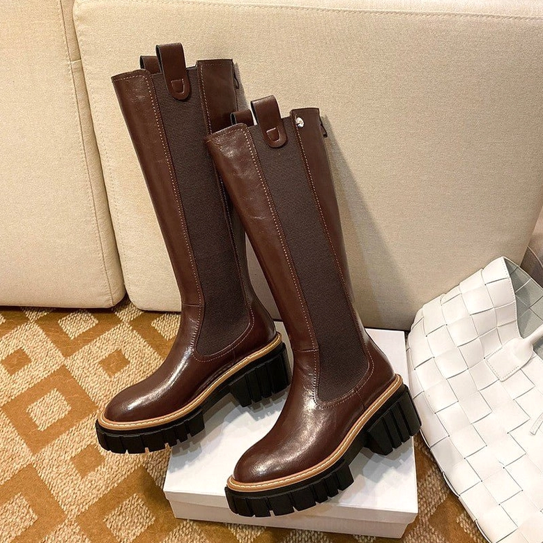 Gothic platform boots pair flat lay showing brown and black options with chunky lug sole detail