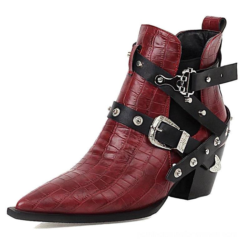Pointed toe gothic ankle boots with hardware embellishments and square heel construction detail view
