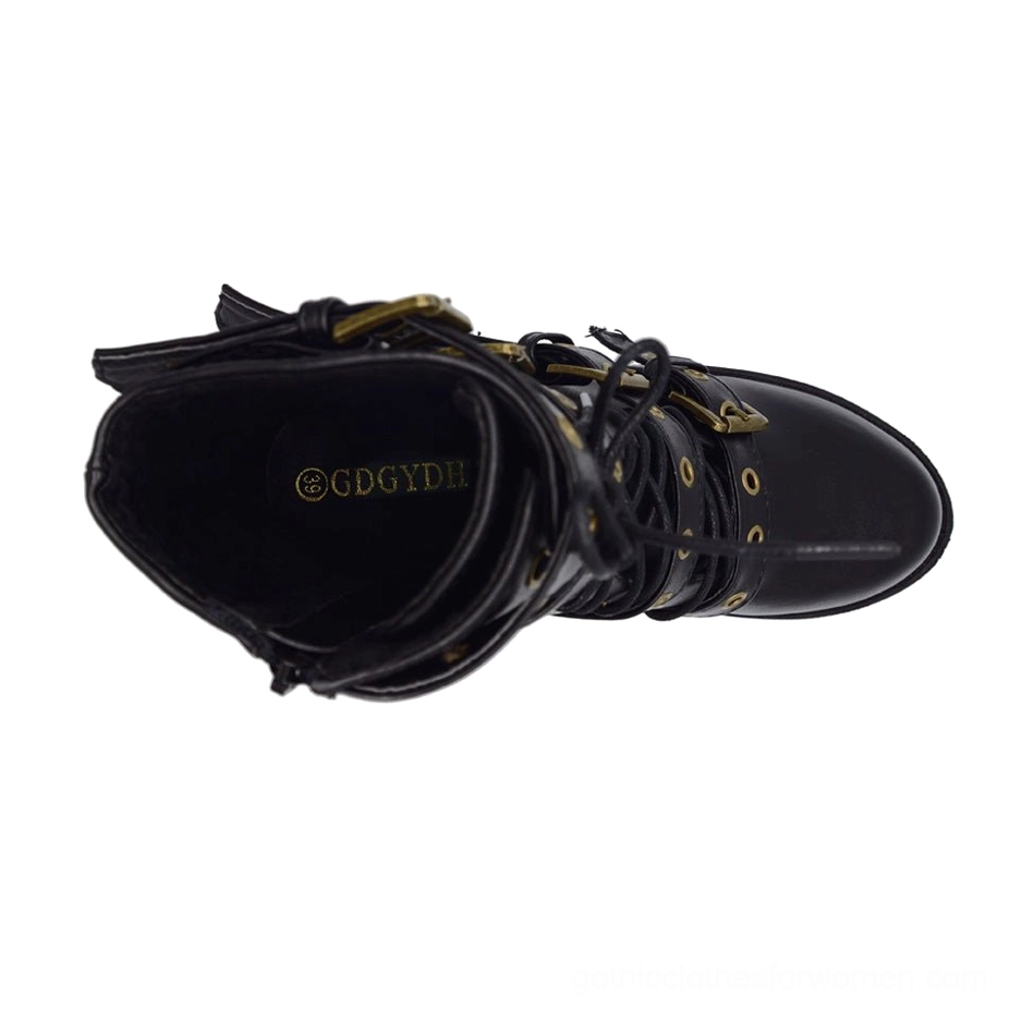 Interior overhead view of black gothic boot showing metal eyelets, lining construction, and branded interior marking