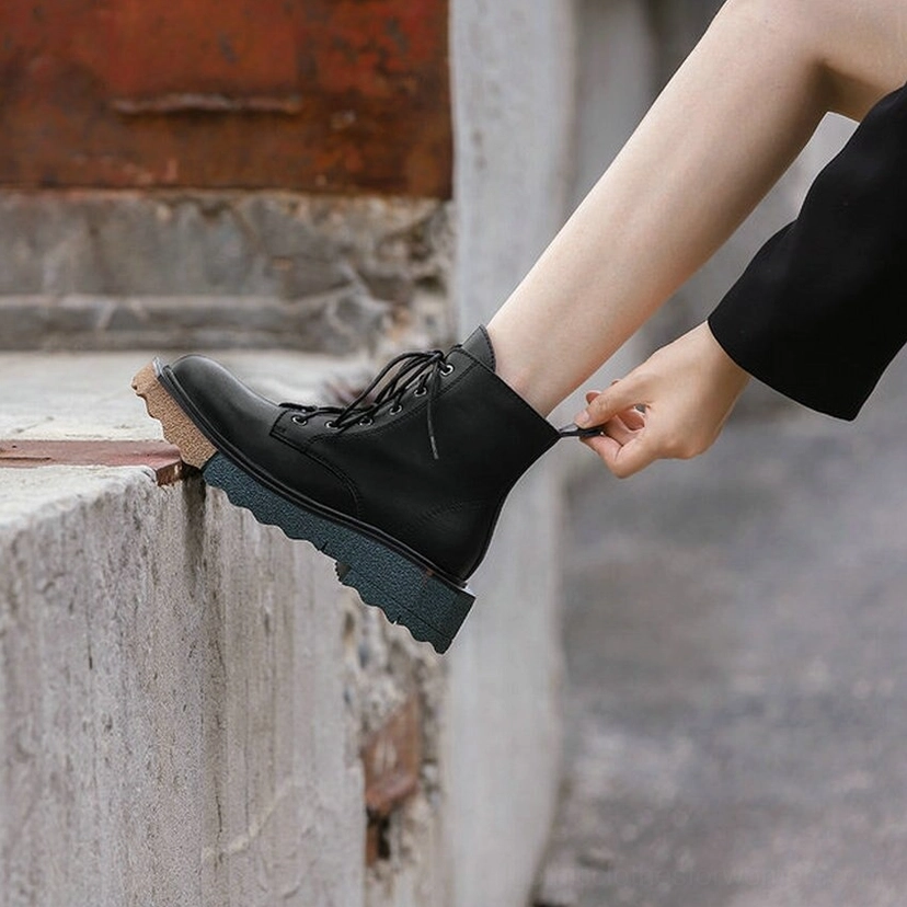 Women's gothic platform ankle boots with chunky sole and authentic leather craftsmanship, professional product presentation