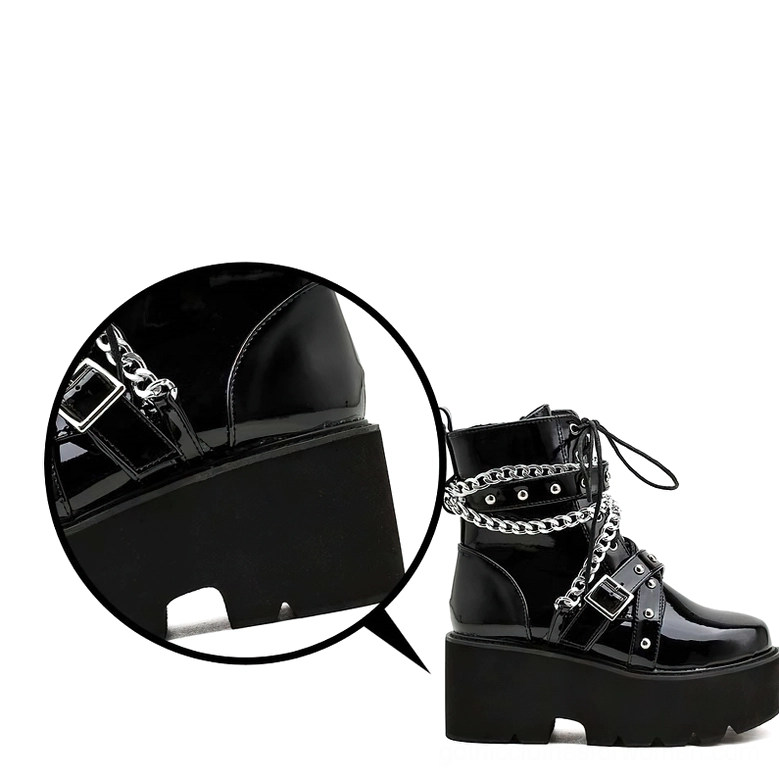Gothic boots detailed view of rubber platform sole, thick block heel, and metal buckle hardware