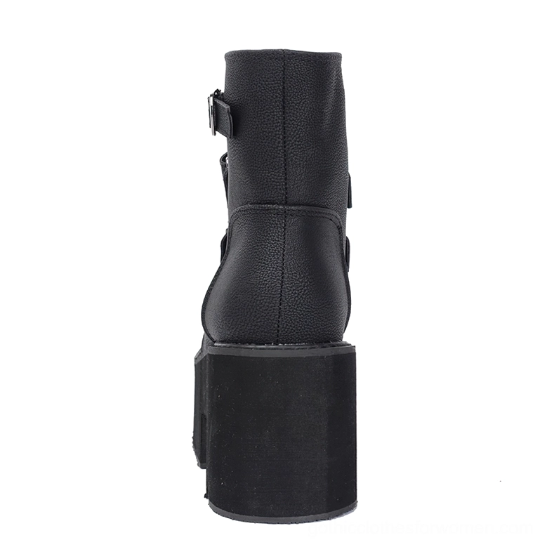 Black ankle-high platform boot rear perspective highlighting side buckle strap and architectural heel design