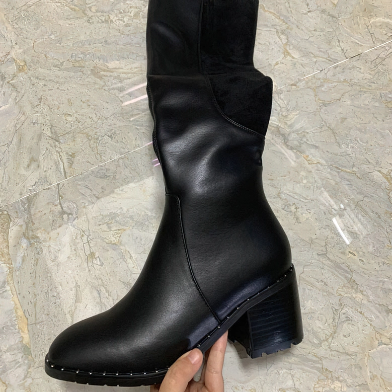 Black leather over-the-knee boots with plush shearling lining detail and square block heel for autumn winter wear