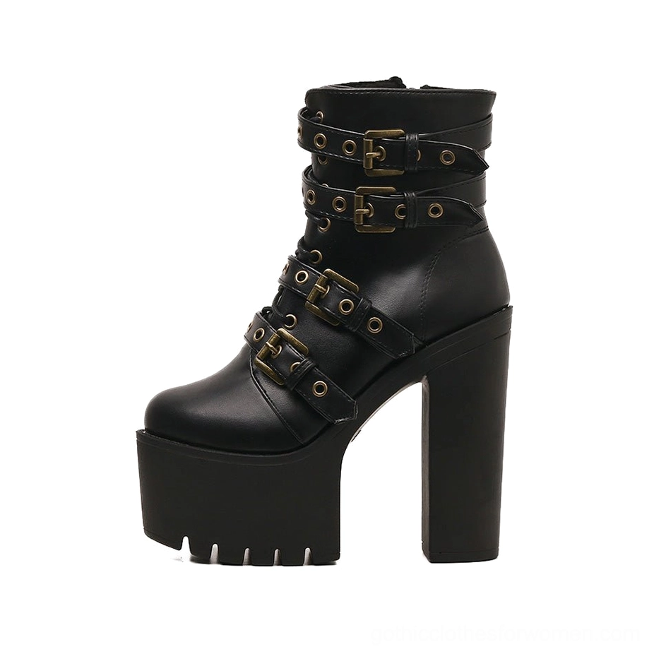 Left side three-quarter view of black gothic ankle boots featuring antiqued metal buckles, thick platform sole, and industrial-style hardware