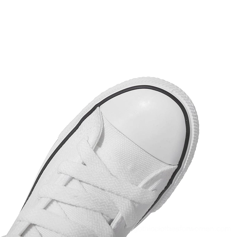 Canvas boot toe area close-up showing rubber toe cap and black border trim