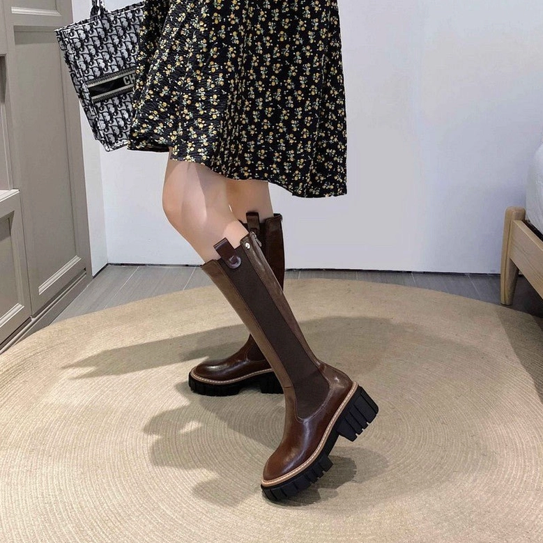 Woman styling brown leather gothic platform boots with floral midi dress for romantic goth aesthetic