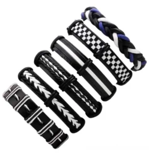 Alternative angle of six piece gothic leather bracelet collection showing striped and patterned wristbands with braided elements