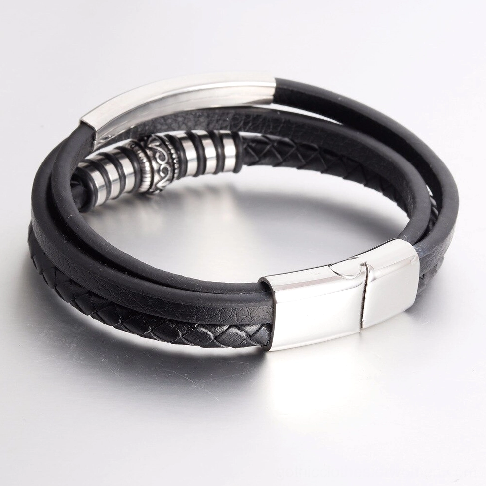 Double layer leather gothic bracelet top down flat lay with engraved metal beads and silver magnetic clasp