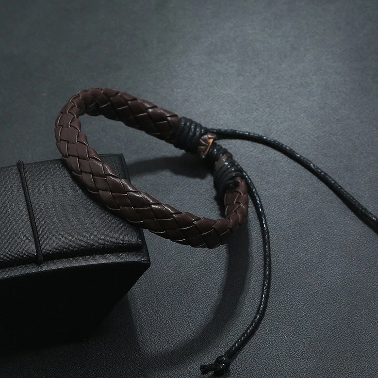 Flat lay arrangement of braided leather gothic bracelets in various alternative colors