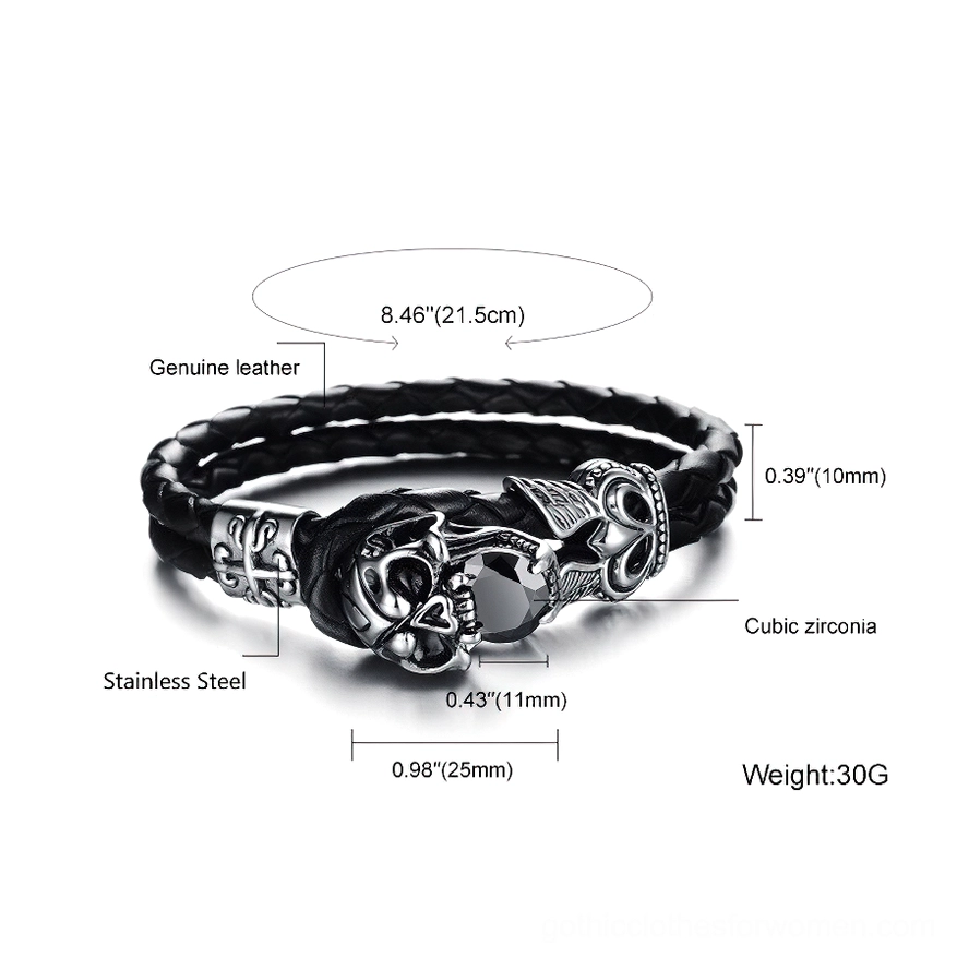 Overhead flat lay of gothic skull charm leather bracelet showing genuine leather construction and stainless steel materials