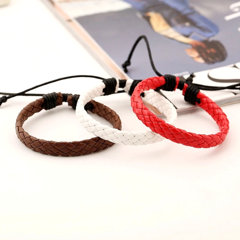 Multiple color variations of handmade braided leather gothic bracelets displayed together