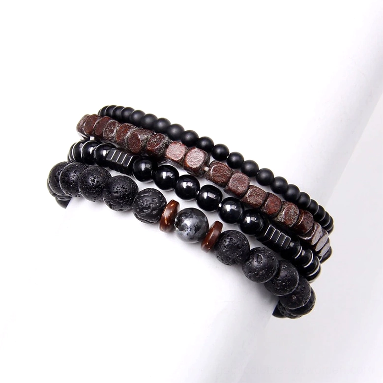 Gothic beaded bracelet set worn on mannequin arm side view showing layered black brown and silver color scheme dark aesthetic stacking