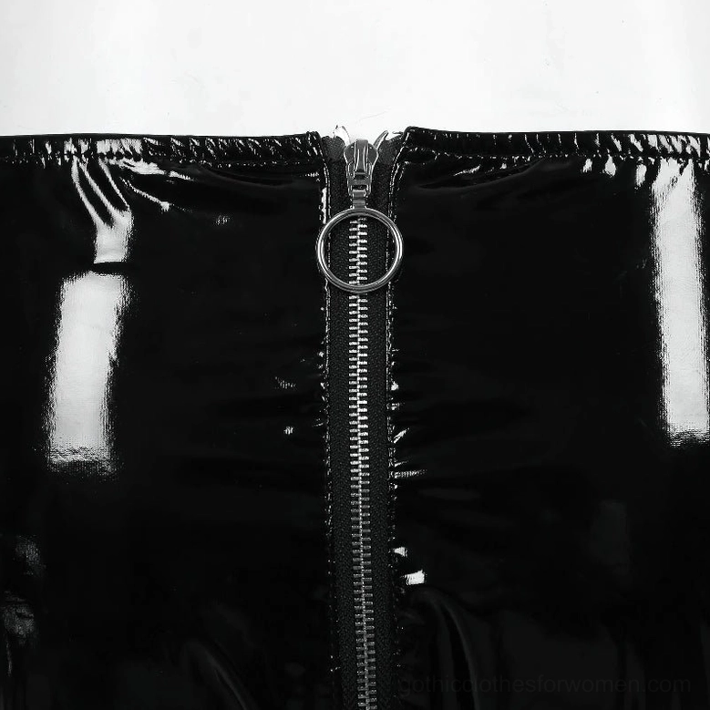 Detailed view of circular metal zipper pull and glossy patent leather finish