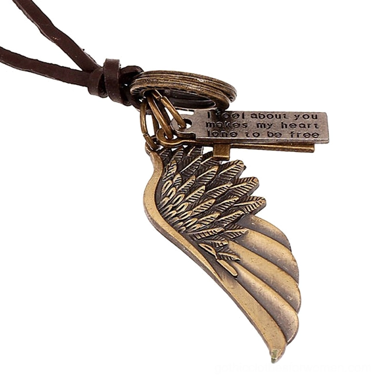 Bronze-toned angel wing and text tag charms on brown leather gothic choker necklace, close-up flat lay detail shot