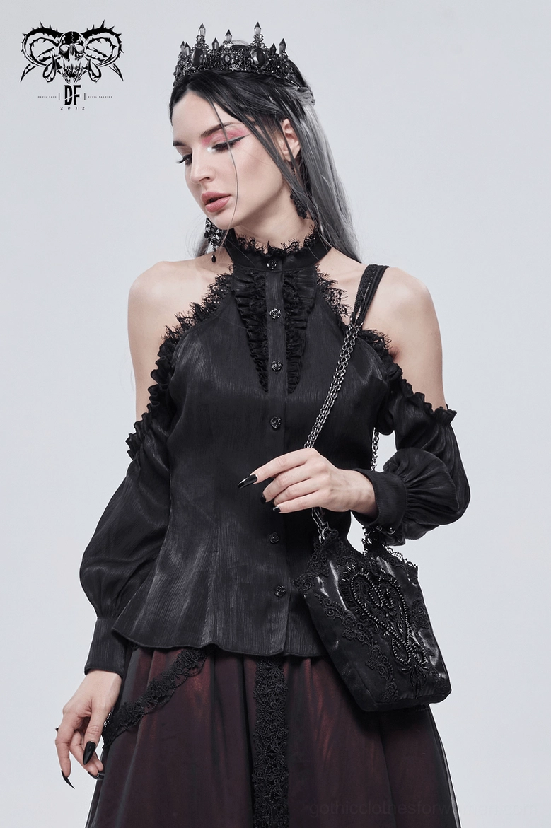 Three-quarter front styling of black gothic bag worn on shoulder with halter neck top