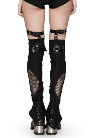 Rear view of gothic buckle leg warmers displaying patent leather accents, flared asymmetrical hem, and adjustable buckle strap system