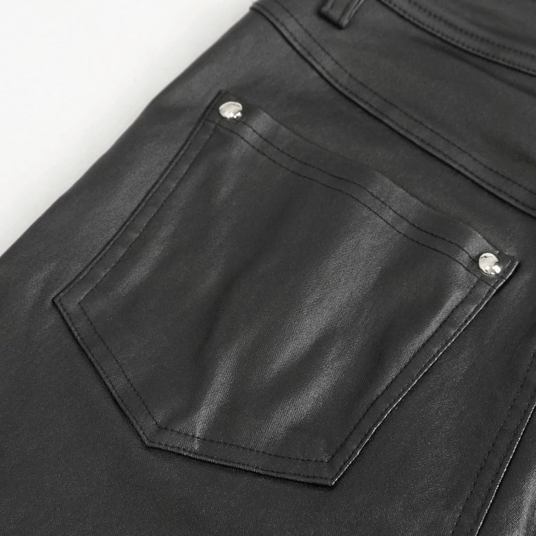 Black gothic buckle pants detail shot emphasizing craftsmanship, metal hardware and stitching quality