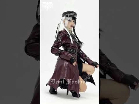 Burgundy gothic faux leather harness coat partial side view detail of buckle panels and patent leather finish