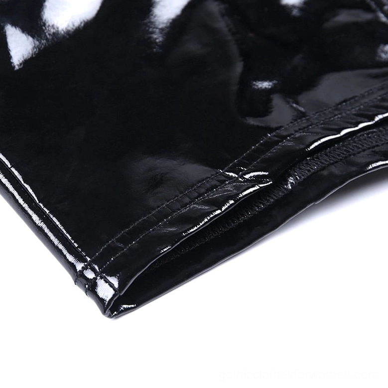 Detailed view of crisscross back straps and zipper on black patent leather gothic crop camisole