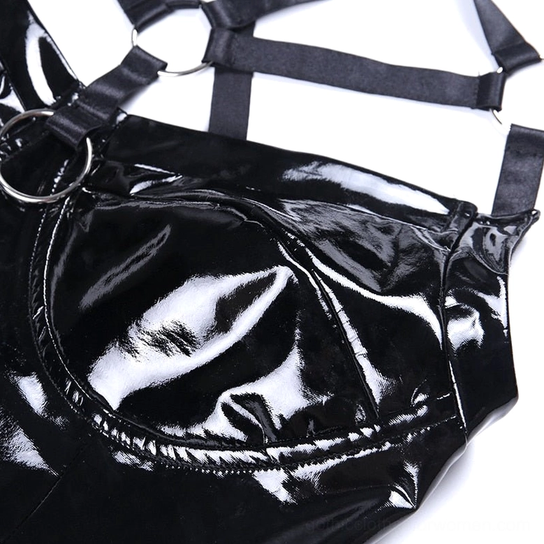Close-up detail of patent leather crop cami cup and webbing strap with metal O-ring hardware