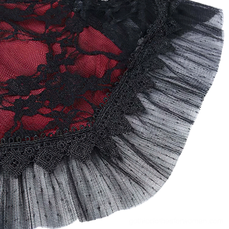 Ruffled tulle hem and black lace trim detail on gothic wine-red camisole, side close-up
