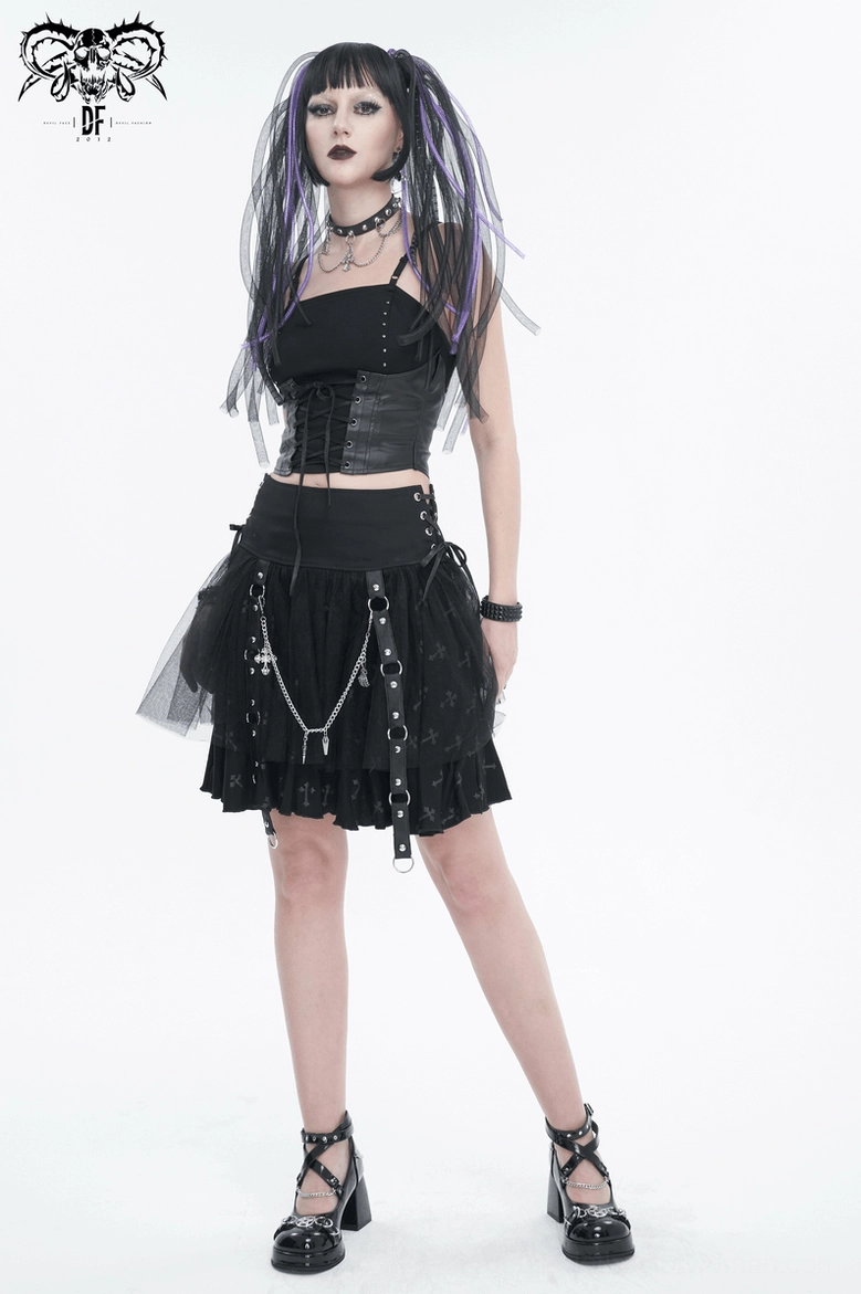 Black gothic lace-up cami top with spaghetti straps and metal hardware accent on display, white background